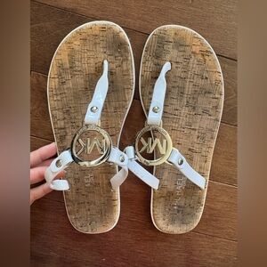 Michael Kors white sandals size 7 silver emblem cork bottom